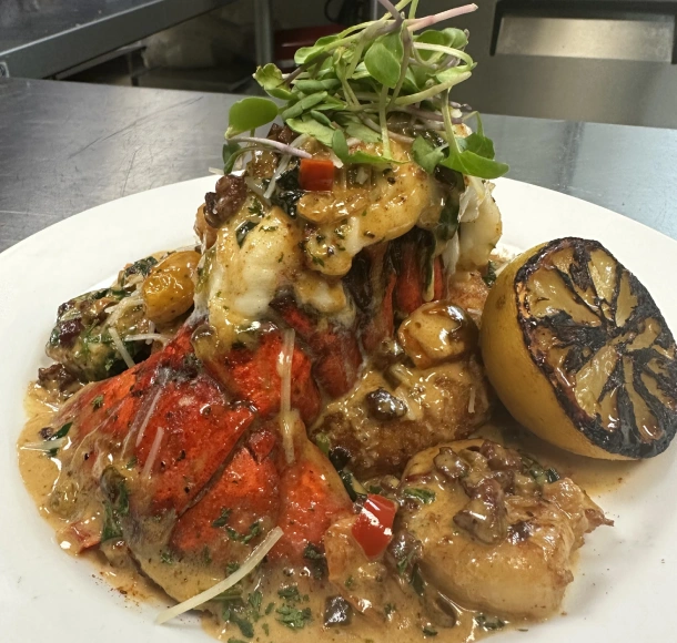 A gourmet seafood dish presented on a white plate